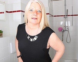 Naughty German housewife playing in her bathroom