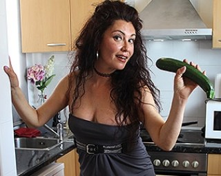 Spanish housewife Zazel Paradise playing with a cucumber