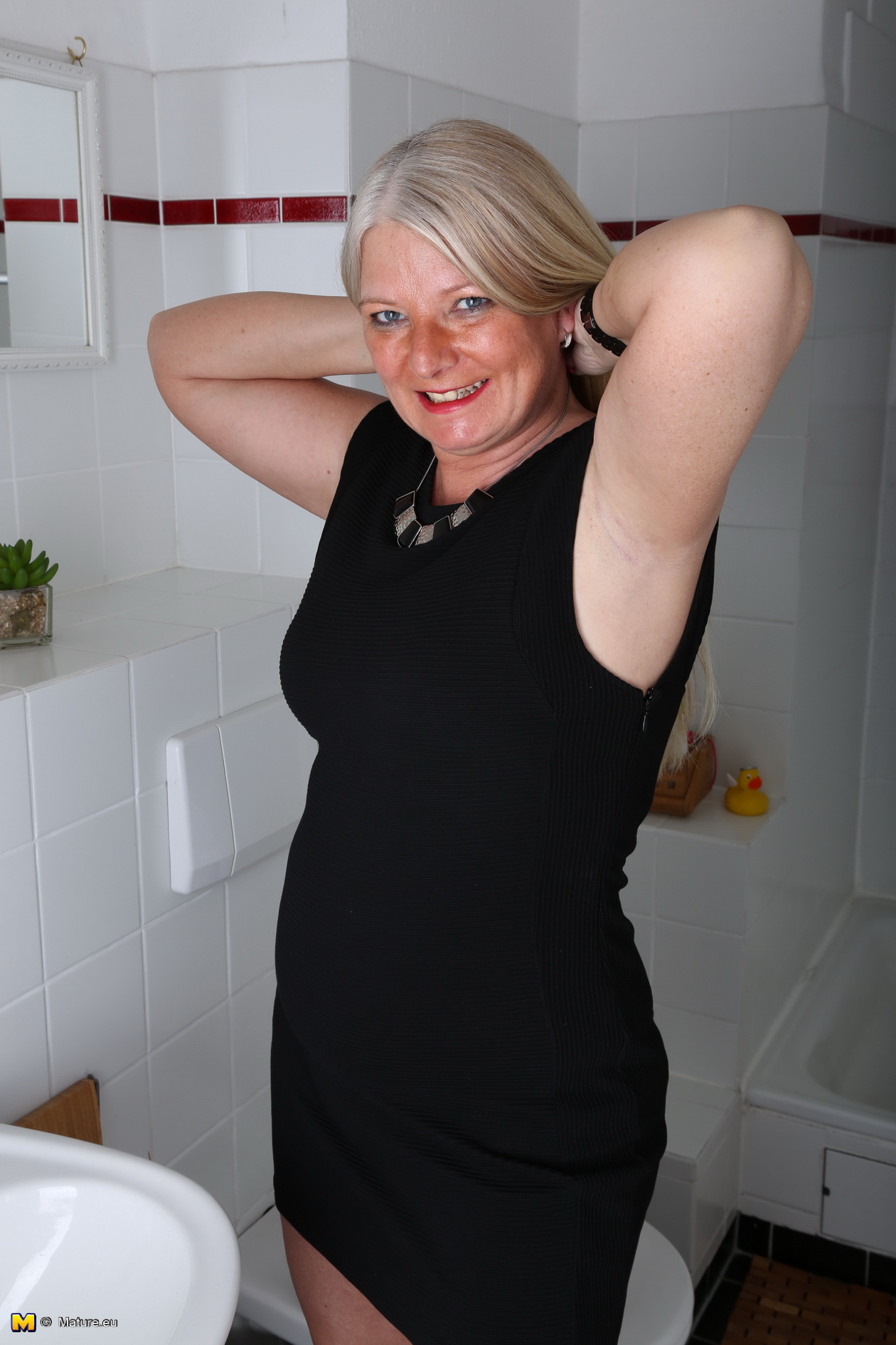 Naughty German housewife taking a shower picture