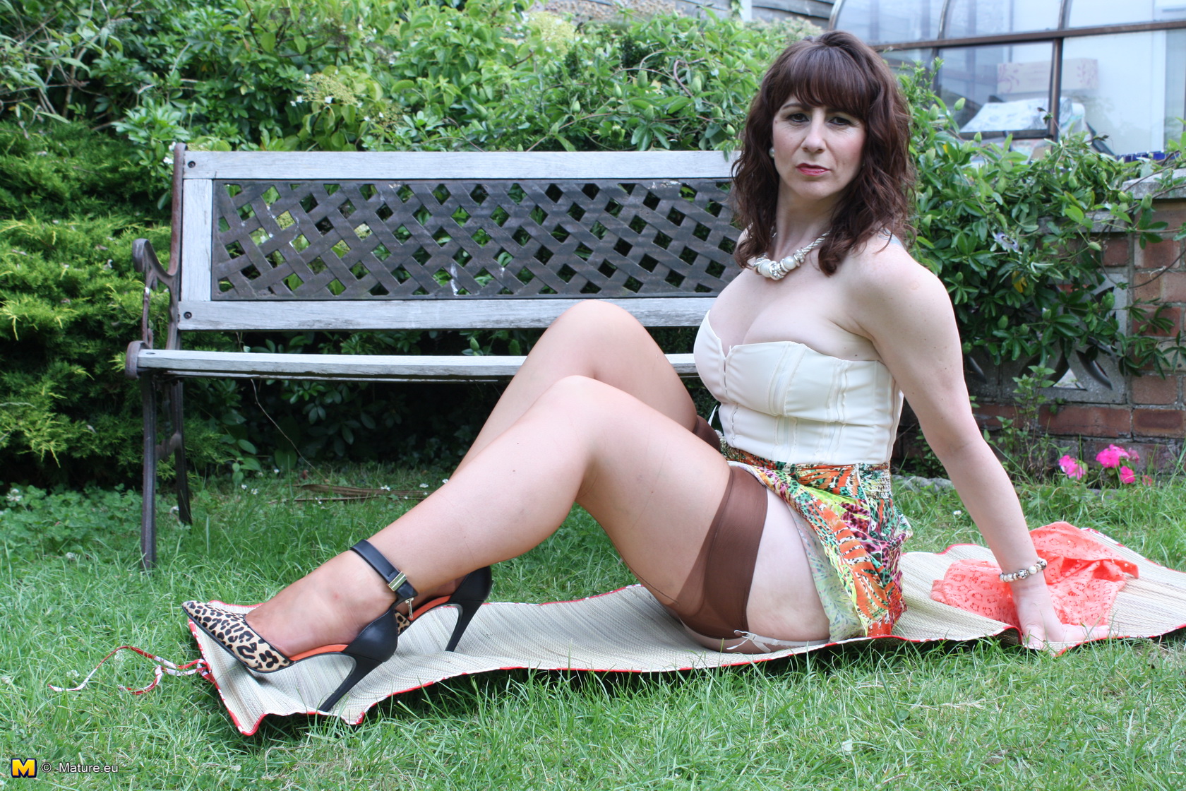 Horny British housewife playing in the garden photo